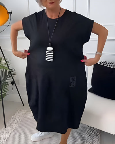 Cleo - Stilfuld kjole med korte ærmer