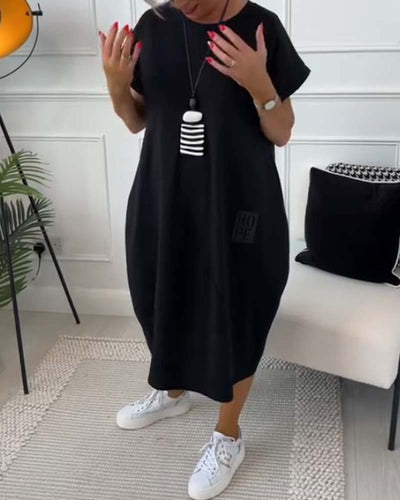Cleo - Stilfuld kjole med korte ærmer