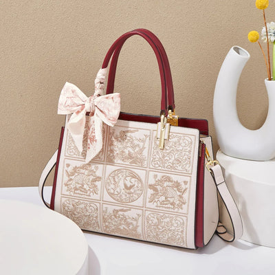 sylvia™ – unik crossbody med broderi og sløjfedetalje