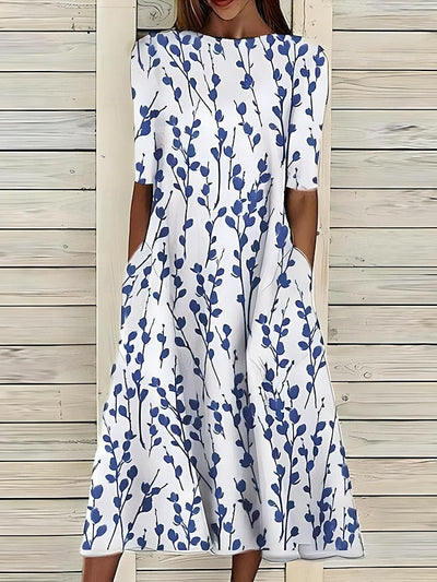Sela – Sommer-midikjole med blomsterprint og kystvibes
