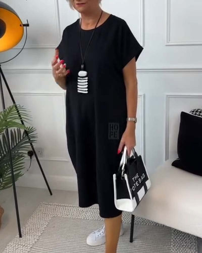 Cleo - Stilfuld kjole med korte ærmer