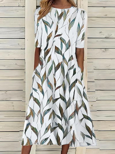 Sela – Sommer-midikjole med blomsterprint og kystvibes