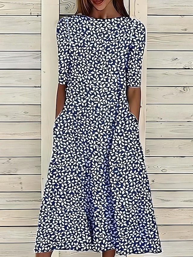 Sela – Sommer-midikjole med blomsterprint og kystvibes