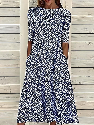 Sela – Sommer-midikjole med blomsterprint og kystvibes